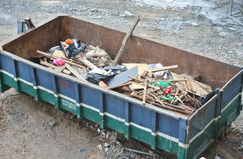 Collection van in front of London neighbourhood with recycling bins